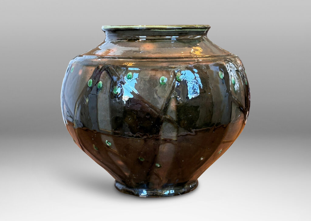 Gallery BAC wide tapered form with large mouth, glazed in orange-brown with dark brown and green piped ornamentation