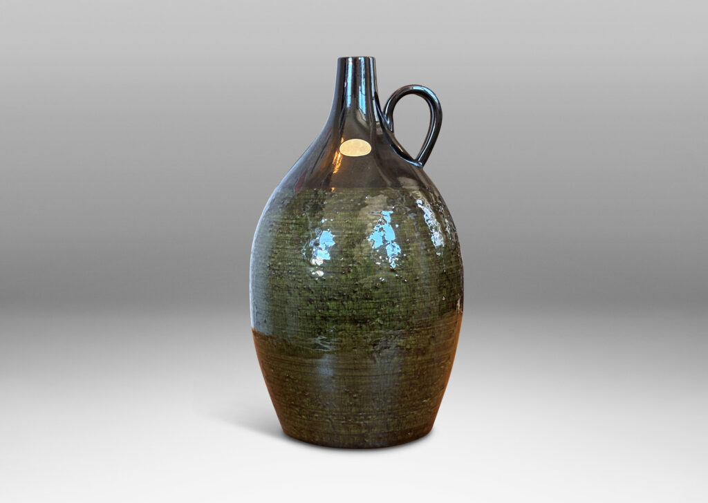 Gallery BAC ovoid form with sprouting neck and loop handles, glazed in brown-black and transparent olive green