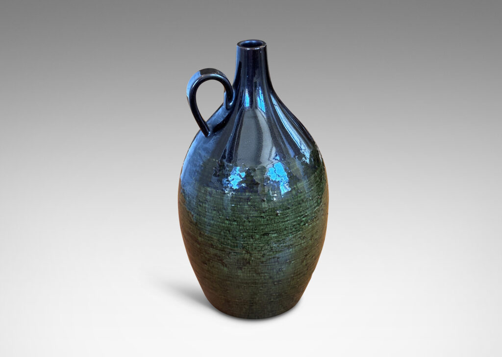Gallery BAC ovoid form with sprouting neck and loop handles, glazed in brown-black and transparent olive green