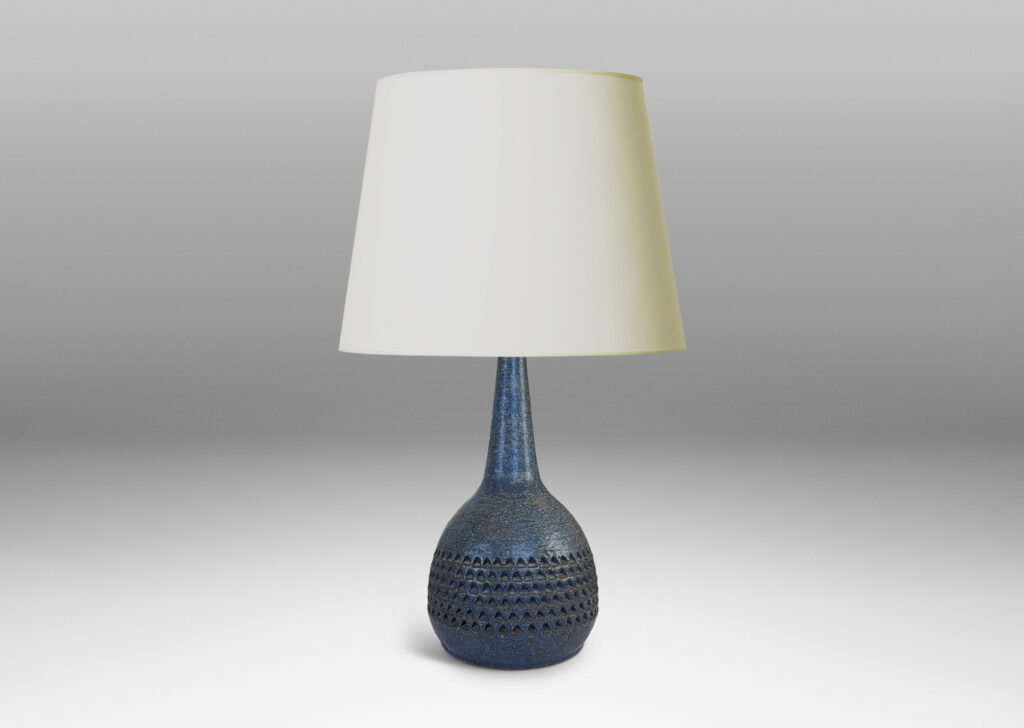 Gallery BAC bulbous form with rows of impressed triangular motifs and conical neck; glazed in a dark blue