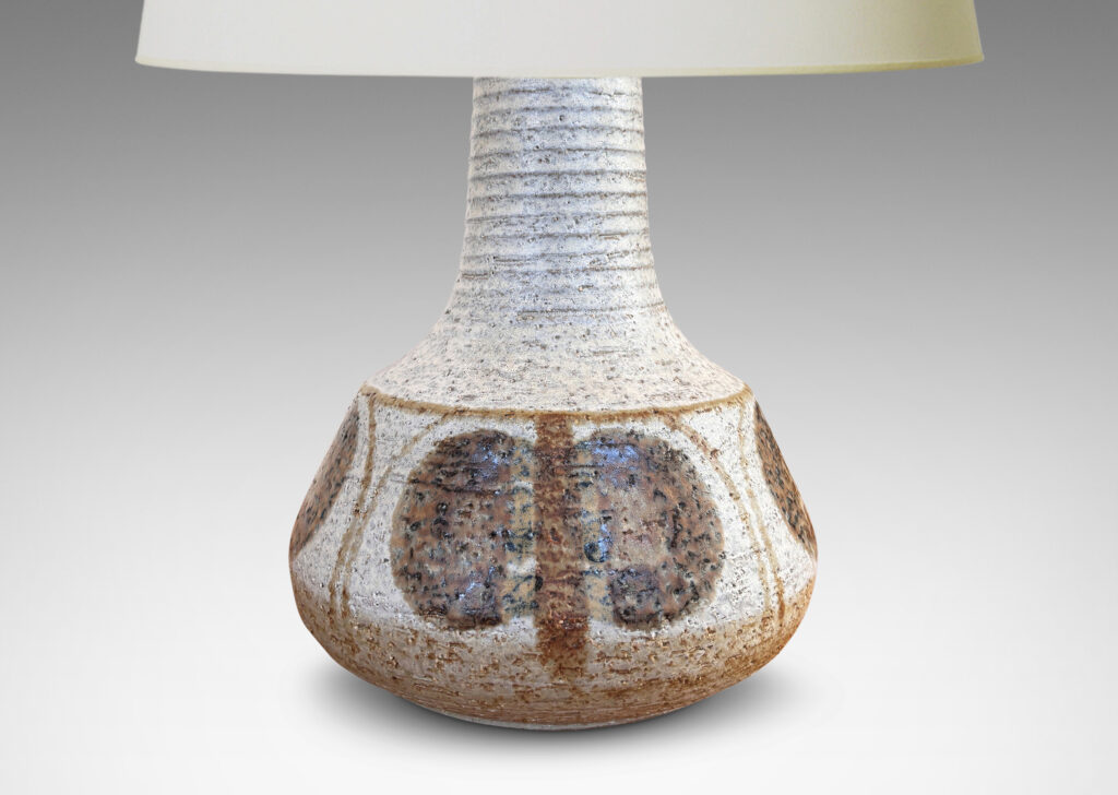Gallery BAC ridged decanter-like form, glazed in a pale gray with painted geometric ornaments in light and dark brown