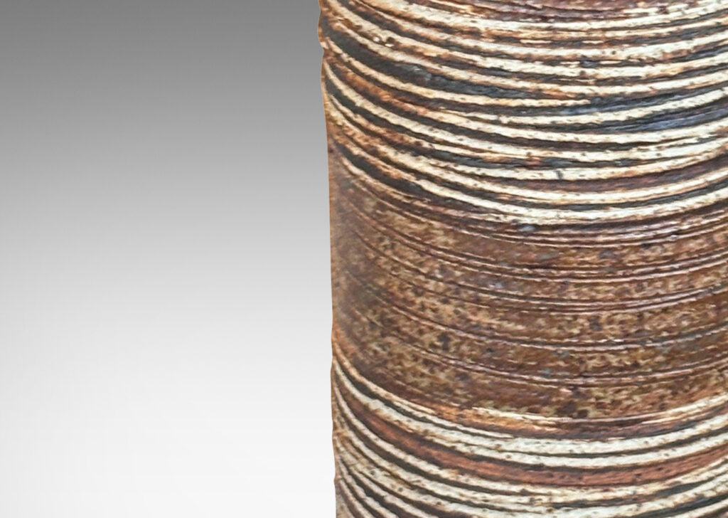 Gallery BAC cylindrical form, partially glazed in dark brown, with carved sgraffito spirals