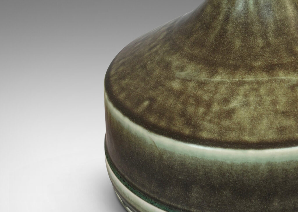Gallery BAC low drum form with sprouting tall necks, glazed in a velvety dark green