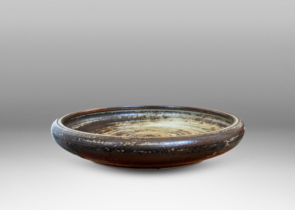 Gallery BAC low organically modeled curving sides and a handsome brown and pale gray “Sung” glaze