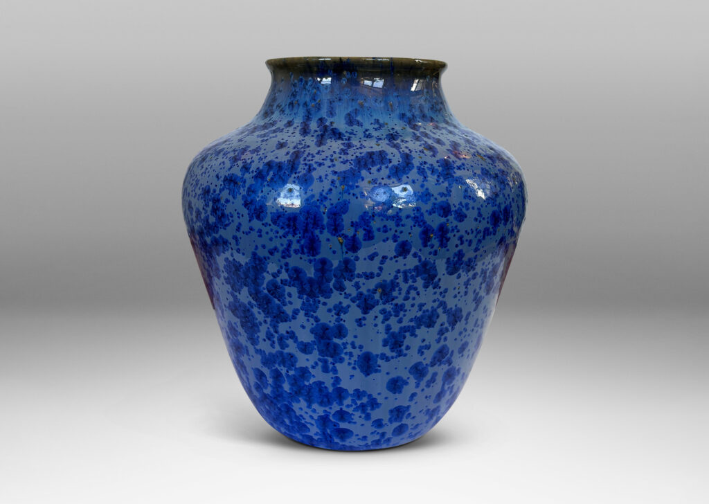 Gallery BAC tapered form with wide mouth, glazed in pale blue with cornflower blue dappling