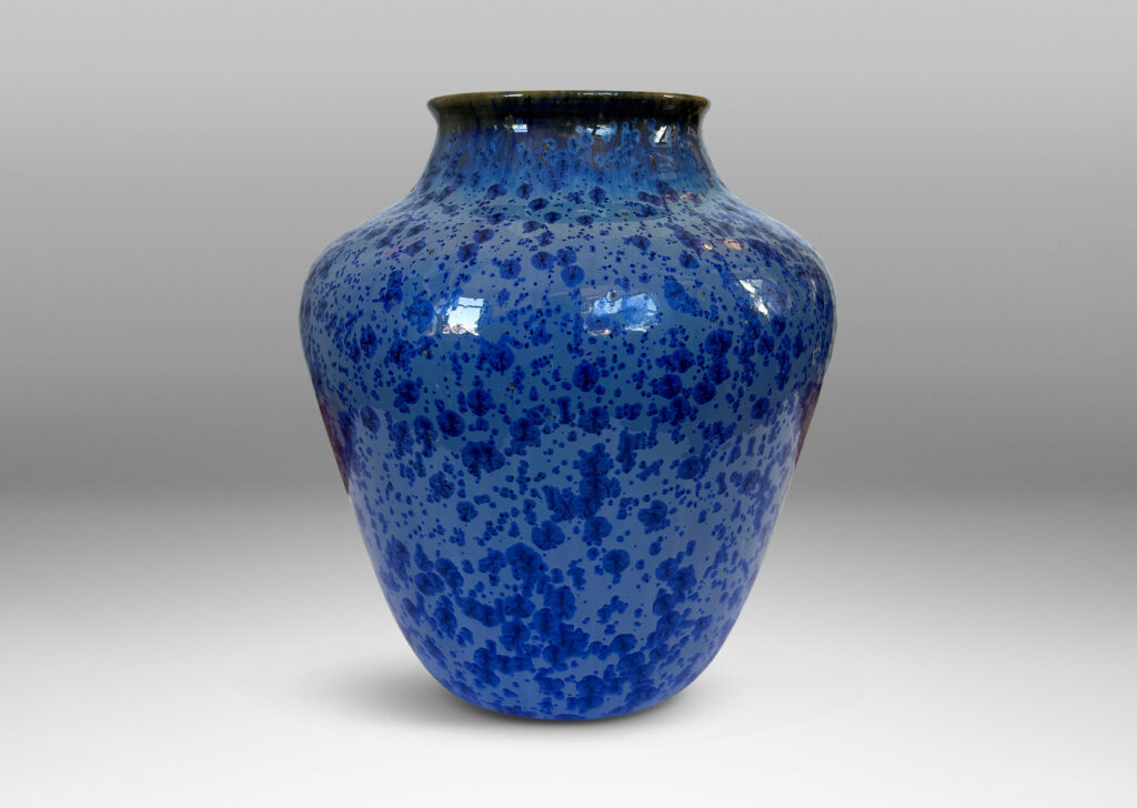 Gallery BAC tapered form with wide mouth, glazed in pale blue with cornflower blue dappling