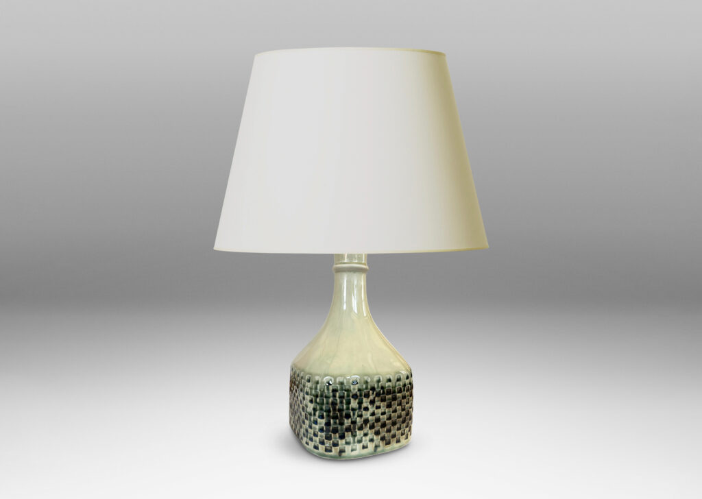 Gallery BAC square bottle-like form with checker reliefs and sprouting neck, glazed in ivory with flowing blue-gray