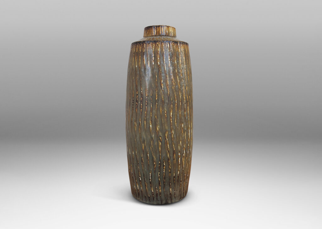 Gallery BAC tall swelling cylindrical form with cuff neck, carved with a diagonal hatch texture