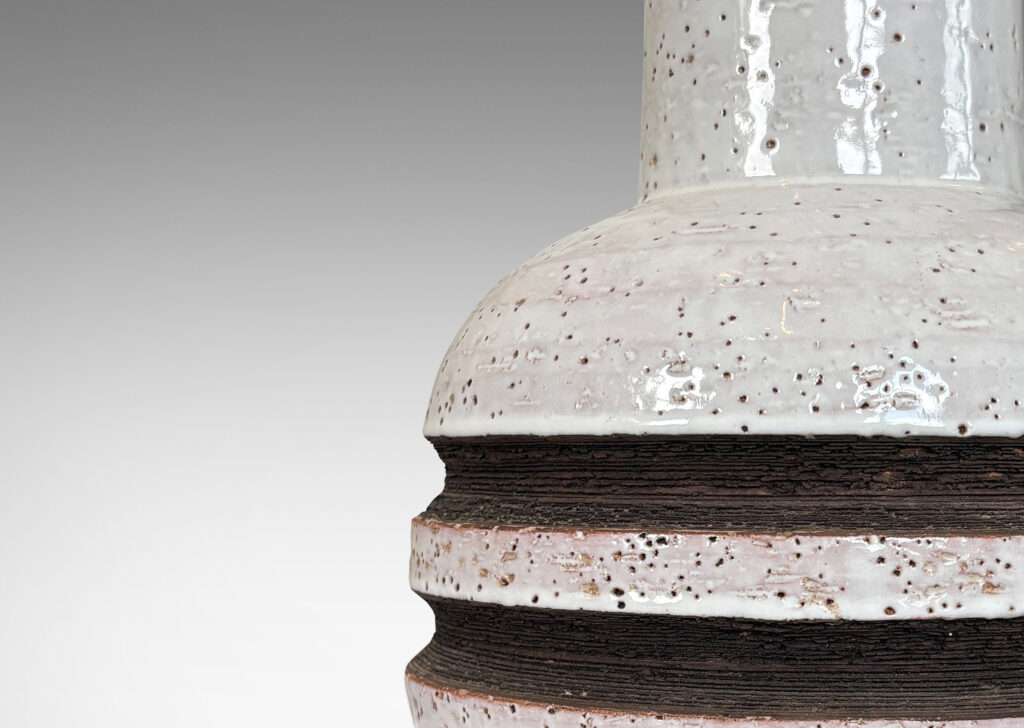 Gallery BAC globe form with recessed bands and tall wide neck, glazed in gloss white with matte brown