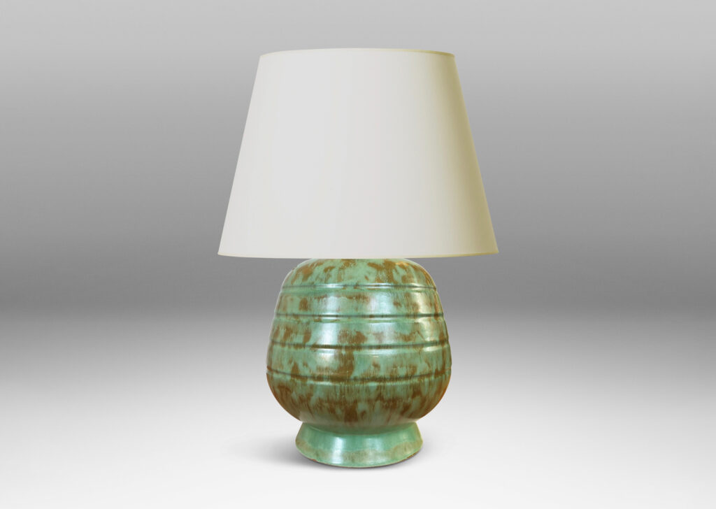 Gallery BAC gumdrop-like form with pinstripe bands on a flanged foot, glazed in a dappled celadon and olive green