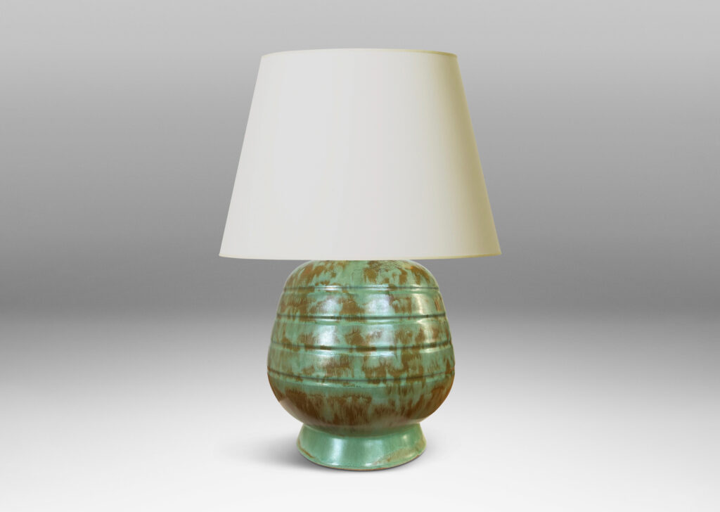 Gallery BAC gumdrop-like form with pinstripe bands on a flanged foot, glazed in a dappled celadon and olive green