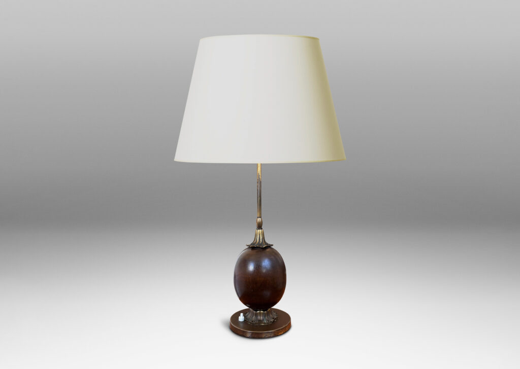 Gallery BAC egg form on foliate mounts and disk base; brass and mahogany