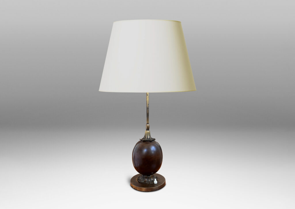 Gallery BAC egg form on foliate mounts and disk base; brass and mahogany