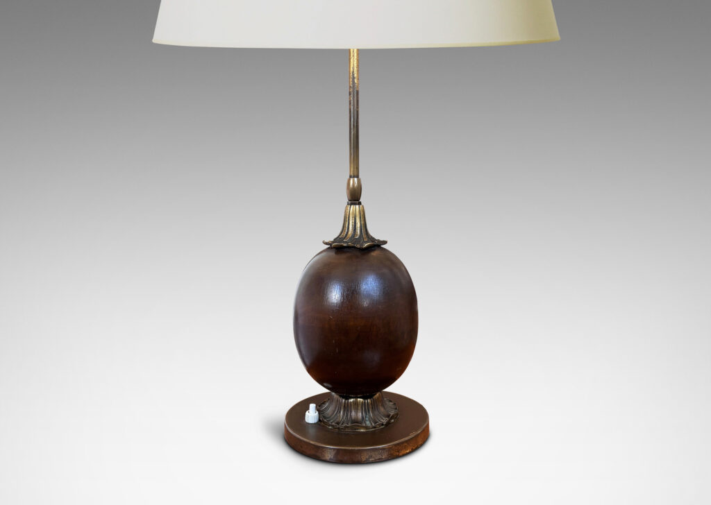 Gallery BAC egg form on foliate mounts and disk base; brass and mahogany