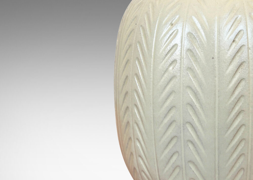 Gallery BAC ovoid form with carved foliate-like meridians, glazed in eggshell finish ivory
