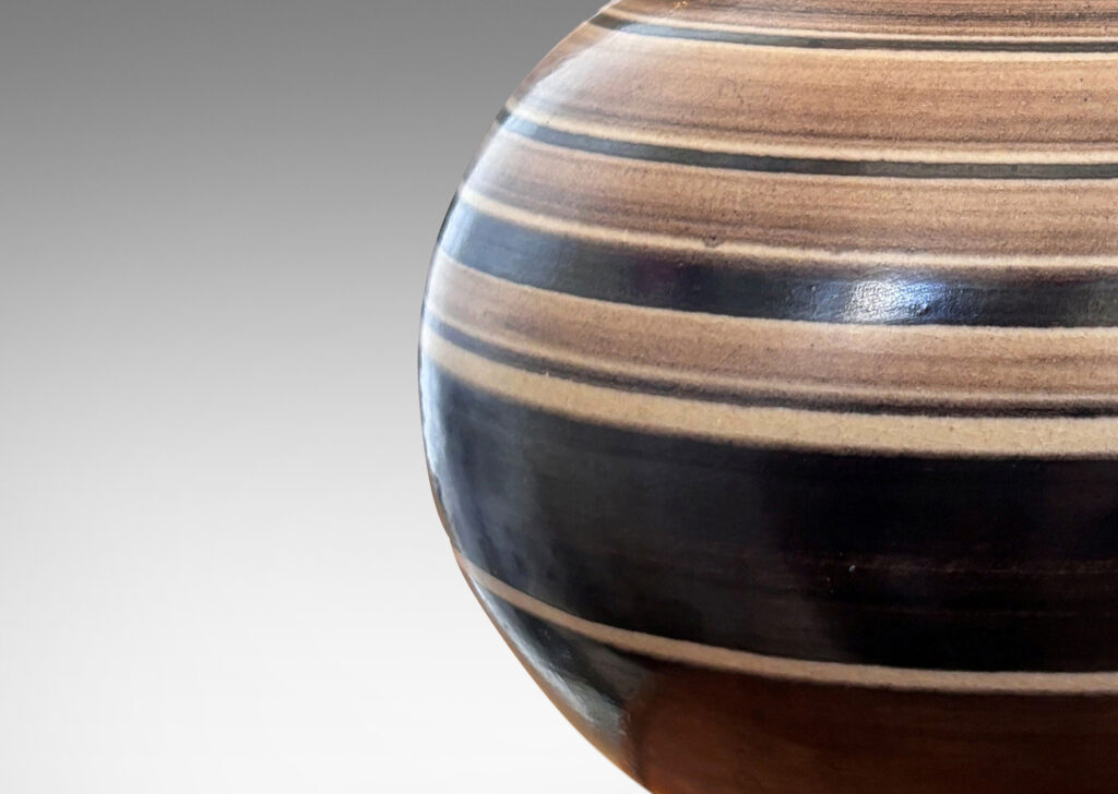 Gallery BAC compressed globe form with collar neck, glazed graded and solid brown bands against ivory