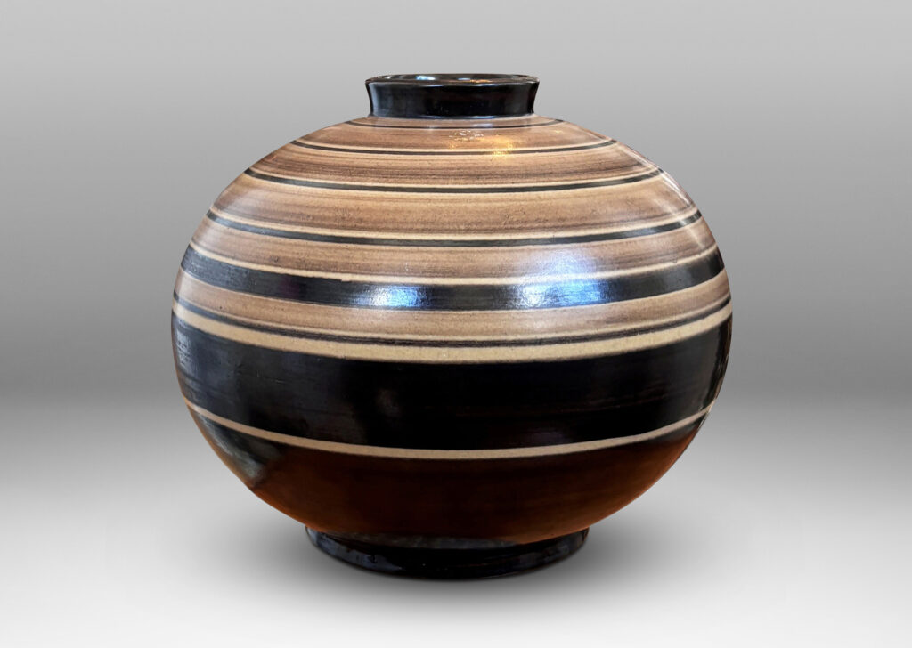 Gallery BAC compressed globe form with collar neck, glazed graded and solid brown bands against ivory