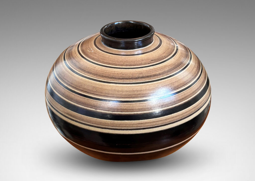 Gallery BAC compressed globe form with collar neck, glazed graded and solid brown bands against ivory