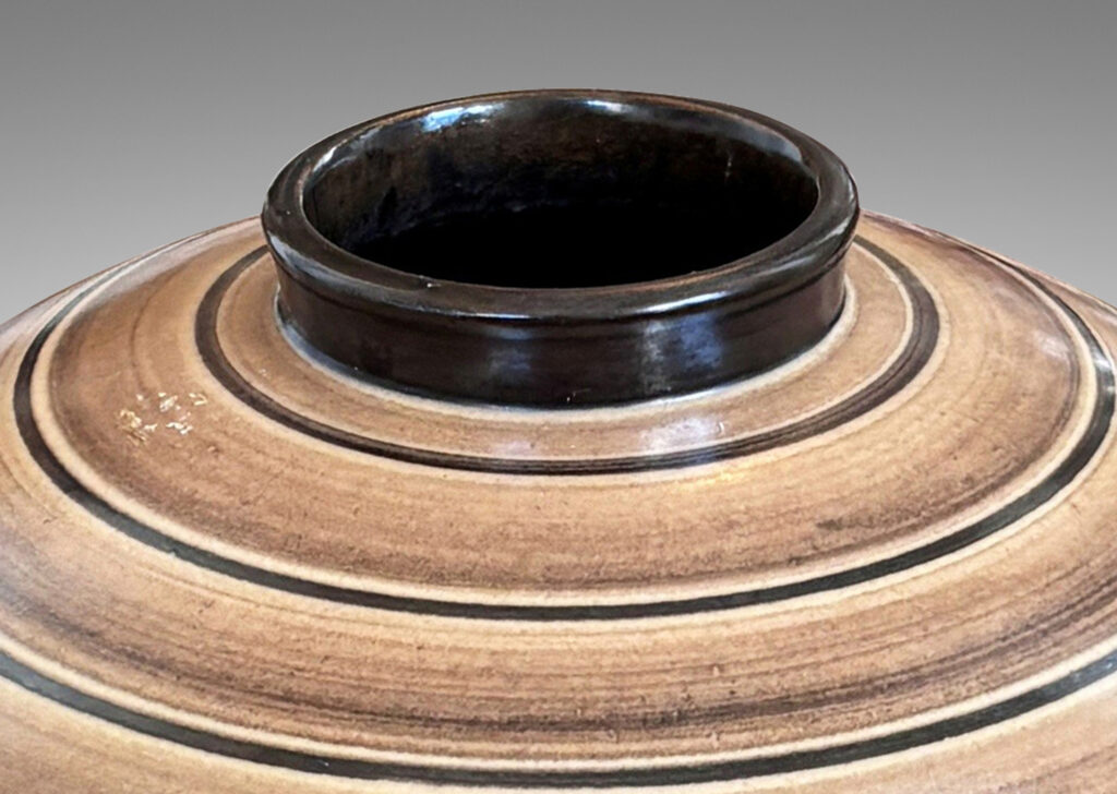 Gallery BAC compressed globe form with collar neck, glazed graded and solid brown bands against ivory