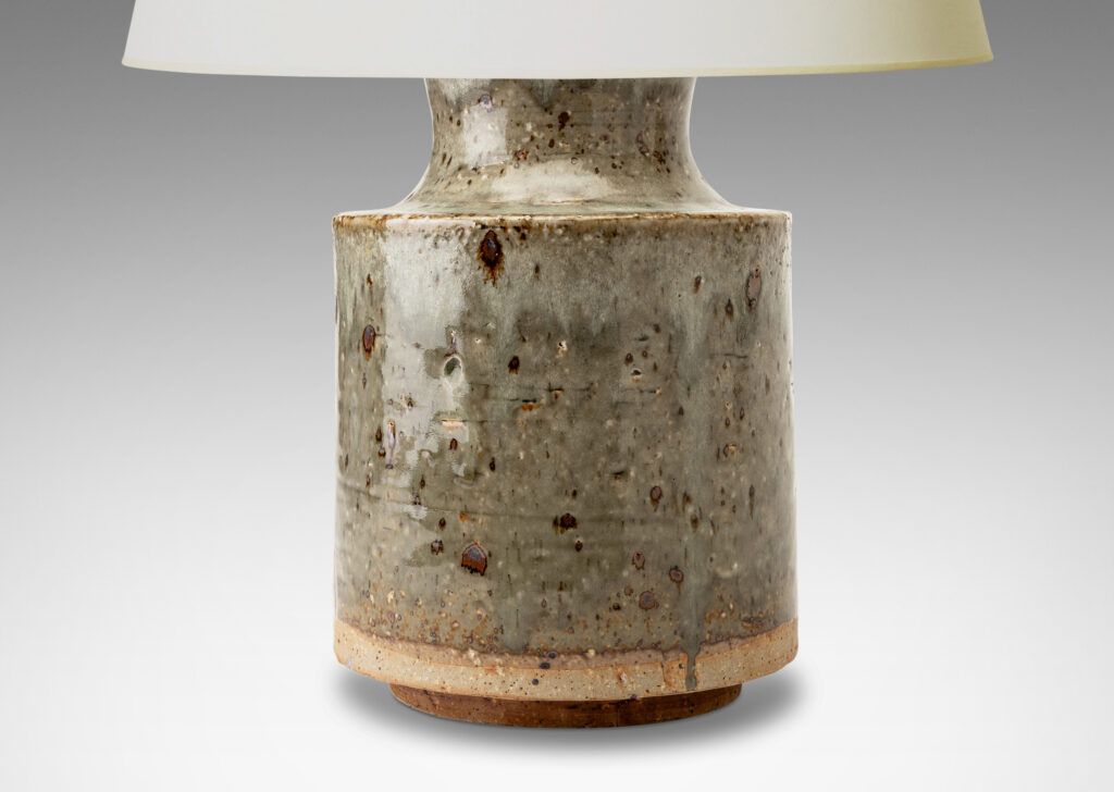 Gallery BAC cylindrical body and cove-sided neck, glazed in a greenish pale gray with dark dappling