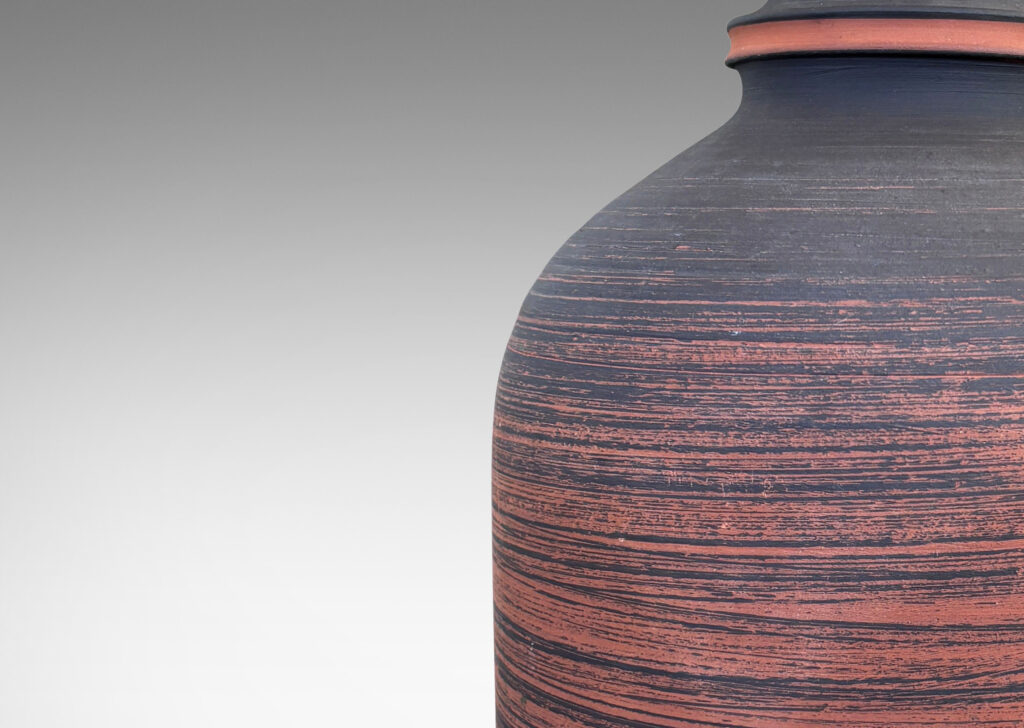 Gallery BAC cloche form with matte striae brown glazing over terra cotta