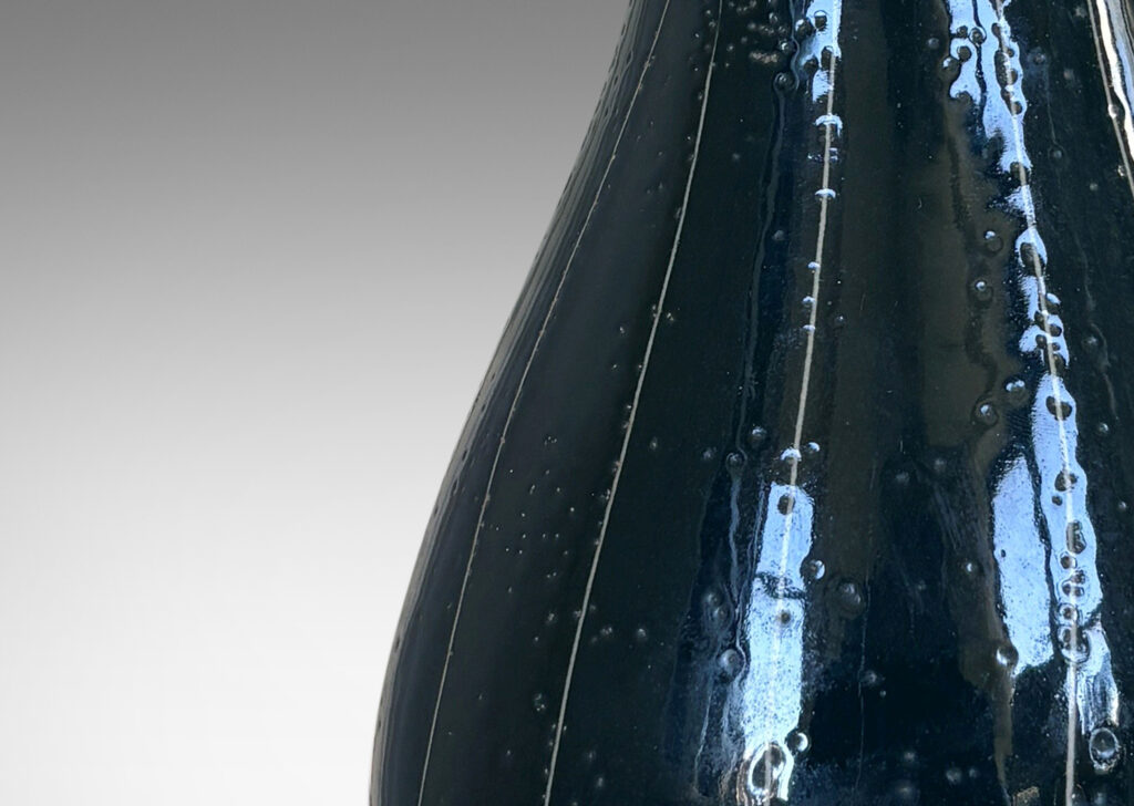 Gallery BAC attenuated double gourd form in shiny teal blue glaze, with sgraffito vertical pinstripes