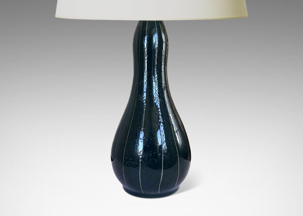 Gallery BAC attenuated double gourd form in shiny teal blue glaze, with sgraffito vertical pinstripes