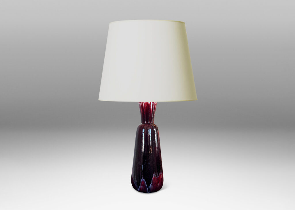 Gallery BAC tall flared form with trumpet mouth, glazed in a flowing oxblood with pale gray accents
