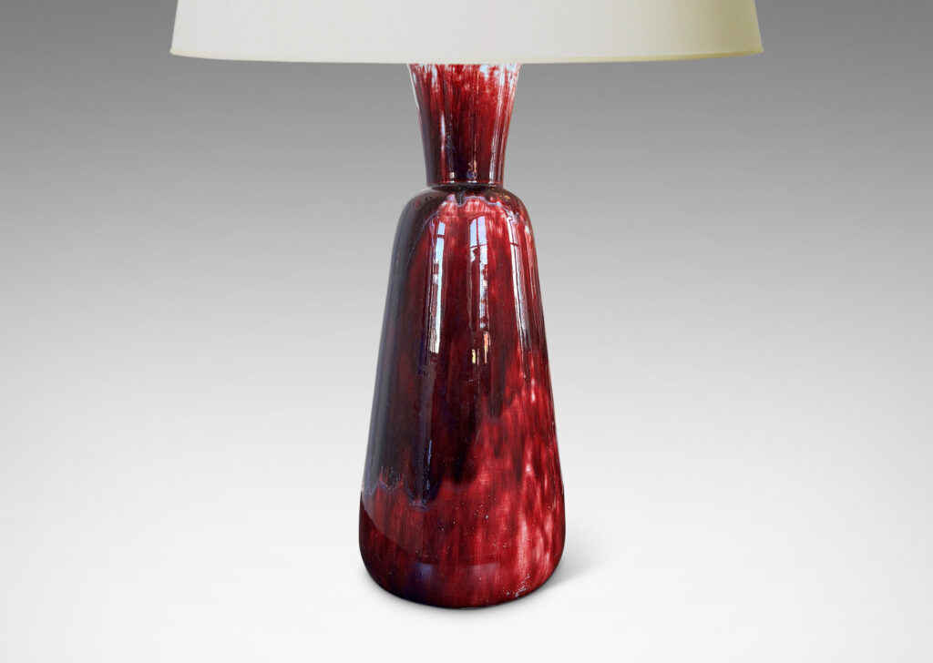 Gallery BAC tall flared form with trumpet mouth, glazed in a flowing oxblood with pale gray accents