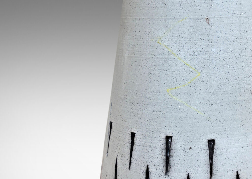 Gallery BAC raked form with carved geometric ornaments, glazed in matte pale taupe and brown