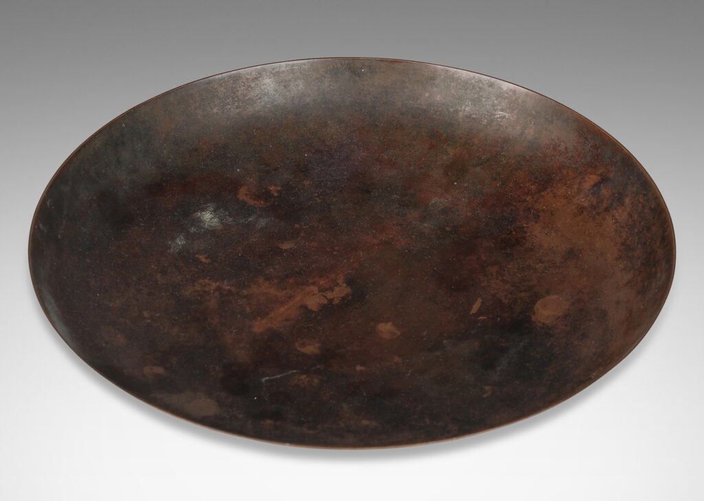 Gallery BAC shallow bowl form on a low stand mounted with baroque modeled brackets, with rich dark patination; bronze