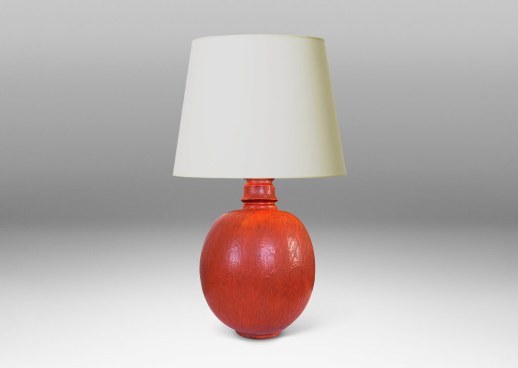 Gallery BAC ovoid form and notched neck with carved surface texture, glazed in orange with gray accents