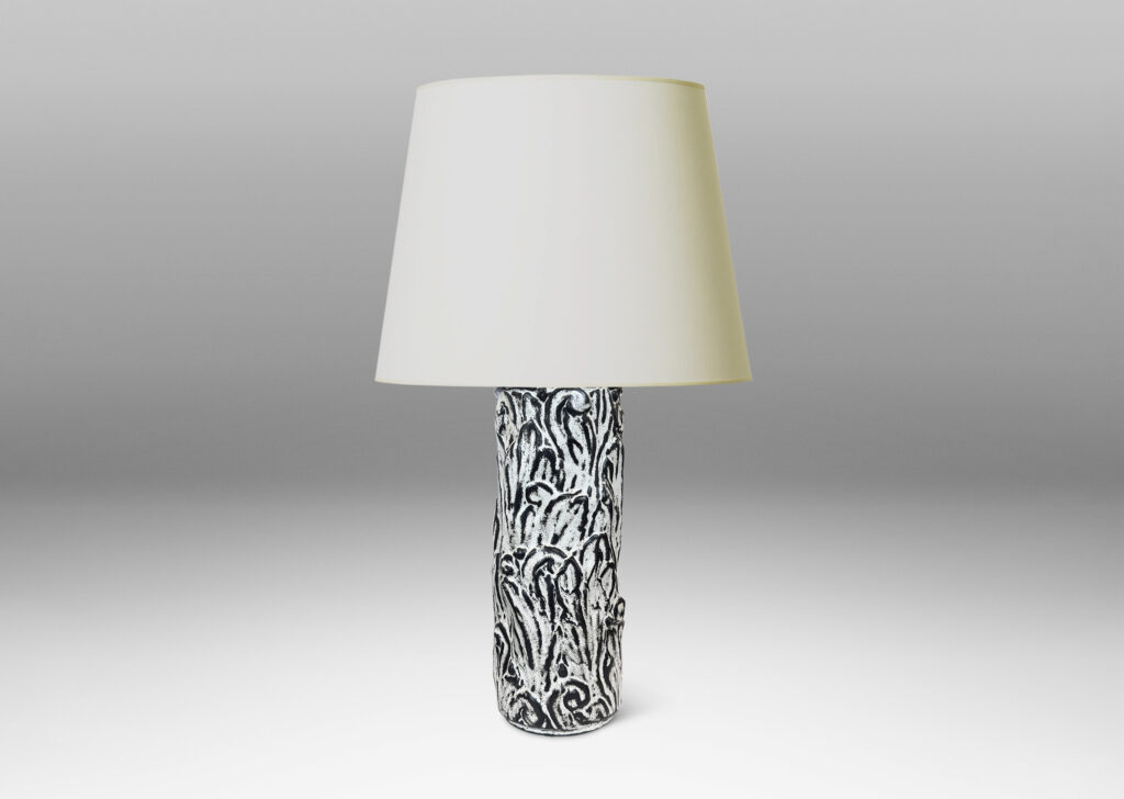 Gallery BAC columnar base surrounded in an energetic acanthus leaf pattern in deep relief, accentuated with a white-black tin glaze