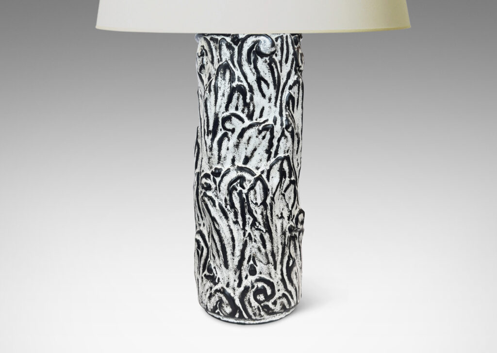Gallery BAC columnar base surrounded in an energetic acanthus leaf pattern in deep relief, accentuated with a white-black tin glaze