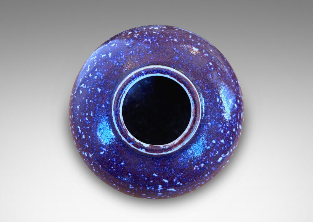 Gallery BAC plump bun form glazed in a violet-burgundy oxblood with pale gray accents