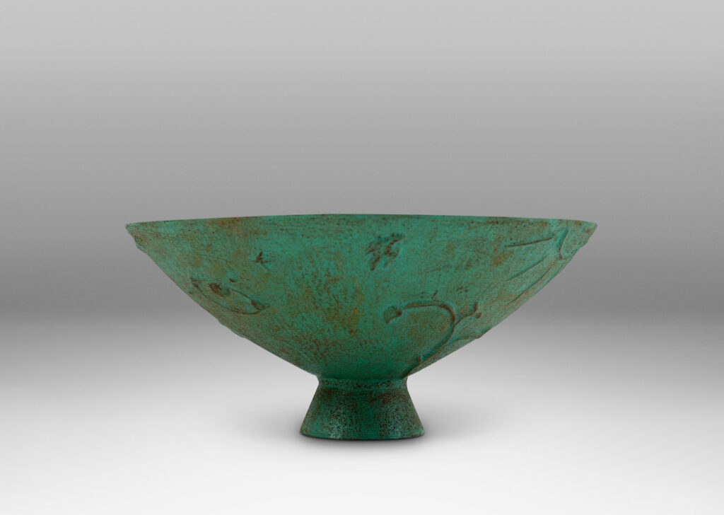 Gallery BAC wide angled forms on a flared stand, with reliefs of flora, birds and celestial bodies, painted in a rare original verdigris-turquoise
