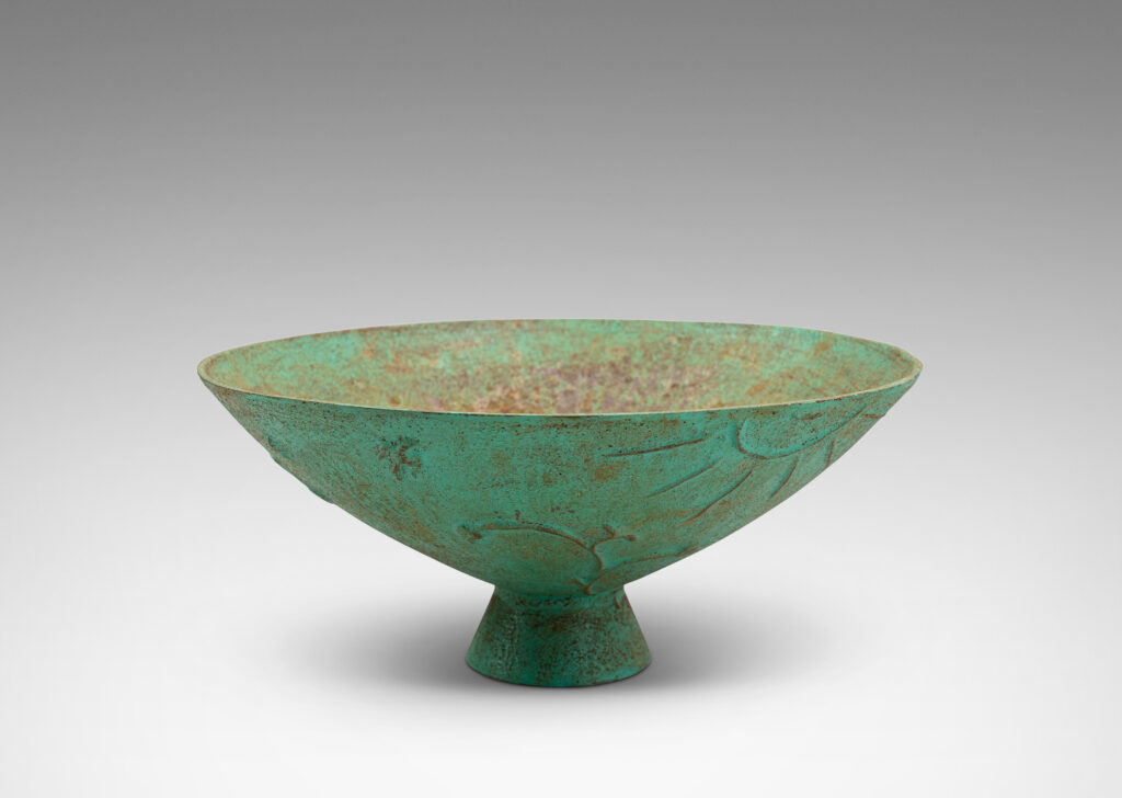 Gallery BAC wide angled forms on a flared stand, with reliefs of flora, birds and celestial bodies, painted in a rare original verdigris-turquoise