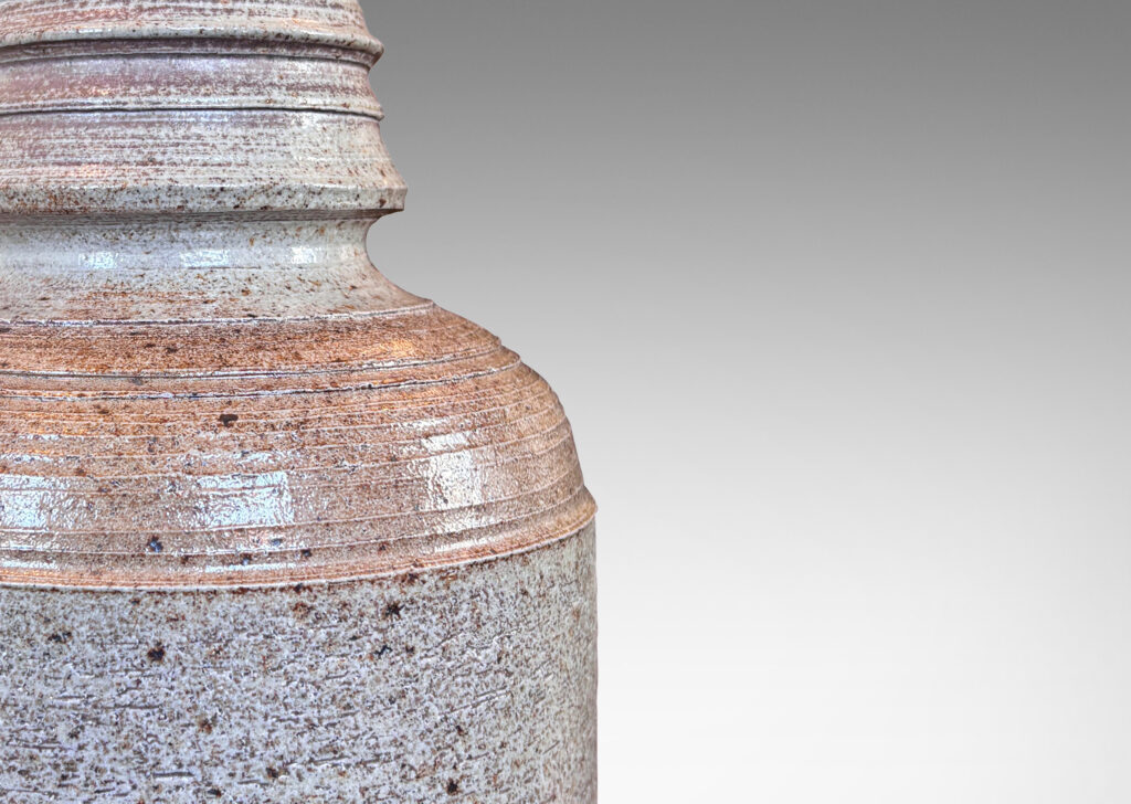 Gallery BAC columnar form with sculpted top, glazed in a light gray with dappling