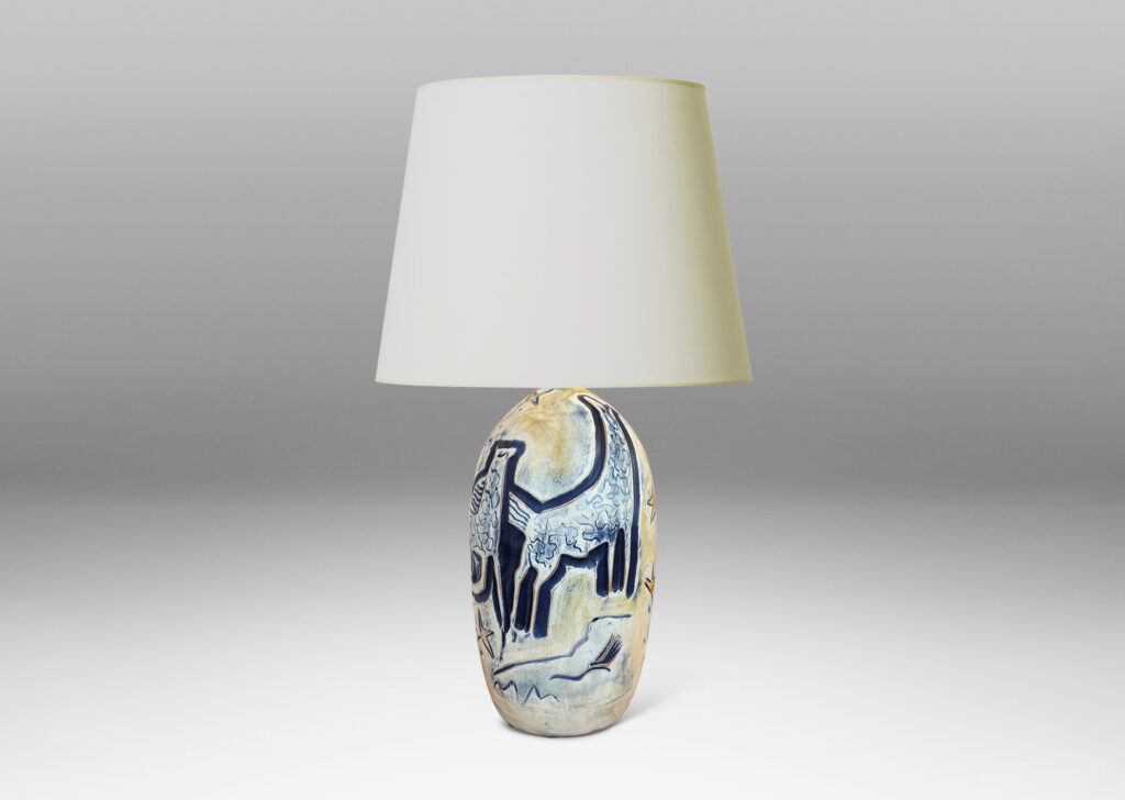 Gallery BAC elongated ovoid form with wonderful carved stylized horses and foliage, glazed in matte blues and yellows