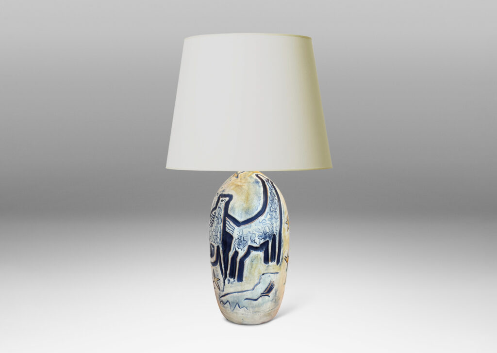 Gallery BAC elongated ovoid form with wonderful carved stylized horses and foliage, glazed in matte blues and yellows
