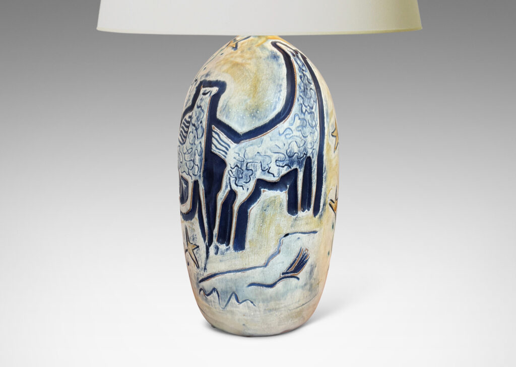Gallery BAC elongated ovoid form with wonderful carved stylized horses and foliage, glazed in matte blues and yellows