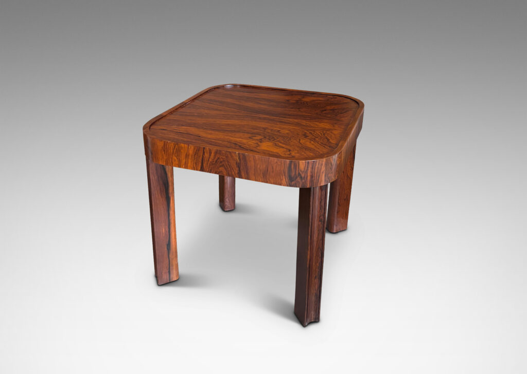 Gallery BAC square top with book-matched veneers and rounded corners, on diagonally set legs with coved faces