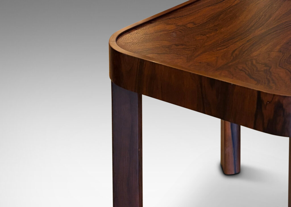 Gallery BAC square top with book-matched veneers and rounded corners, on diagonally set legs with coved faces