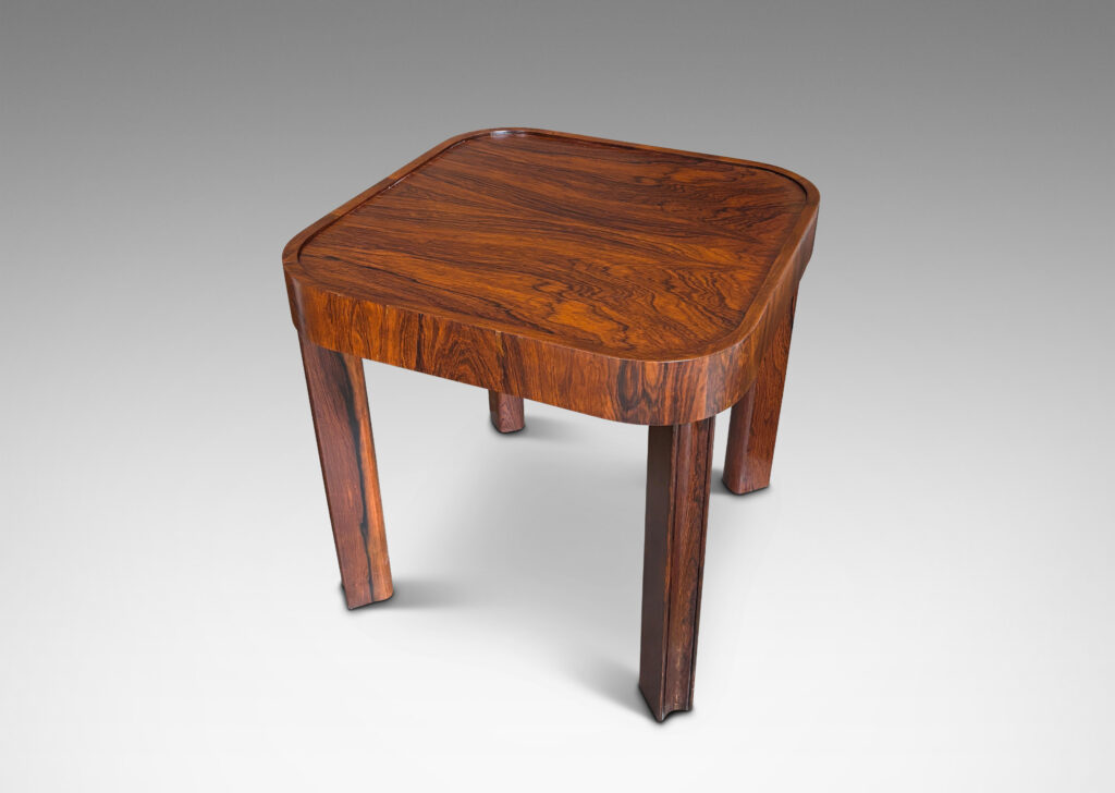 Gallery BAC square top with book-matched veneers and rounded corners, on diagonally set legs with coved faces