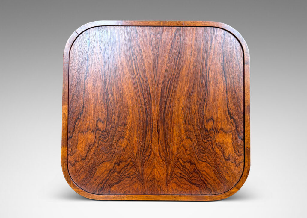 Gallery BAC square top with book-matched veneers and rounded corners, on diagonally set legs with coved faces