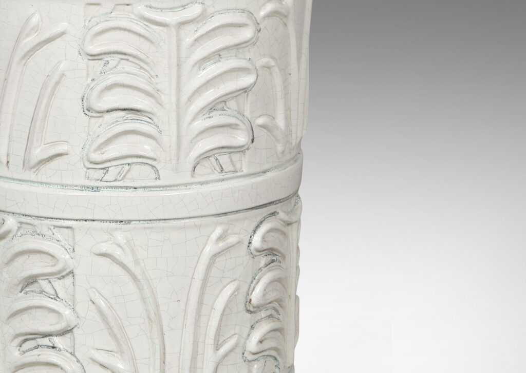 Gallery BAC cylindrical form with relief palmette pattern, glazed in an ivory craquel with black edges