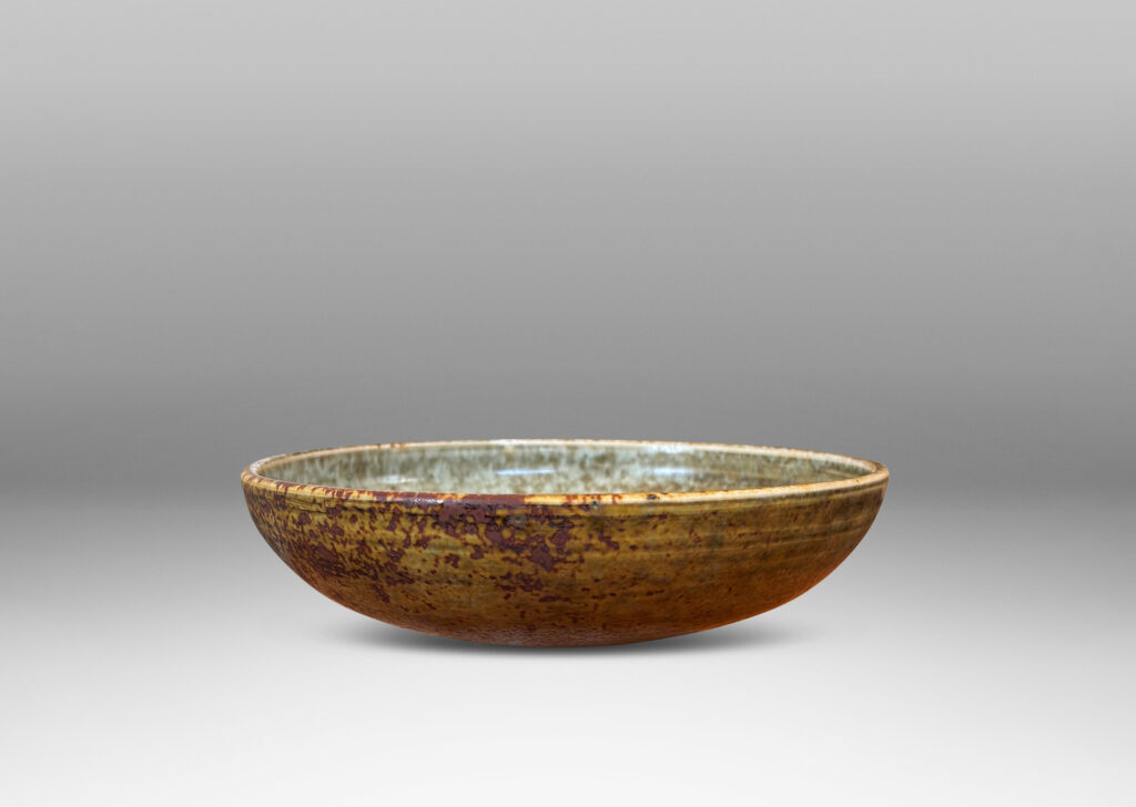 Gallery BAC gently arced form glazed in olive, tan and light blue, stoneware