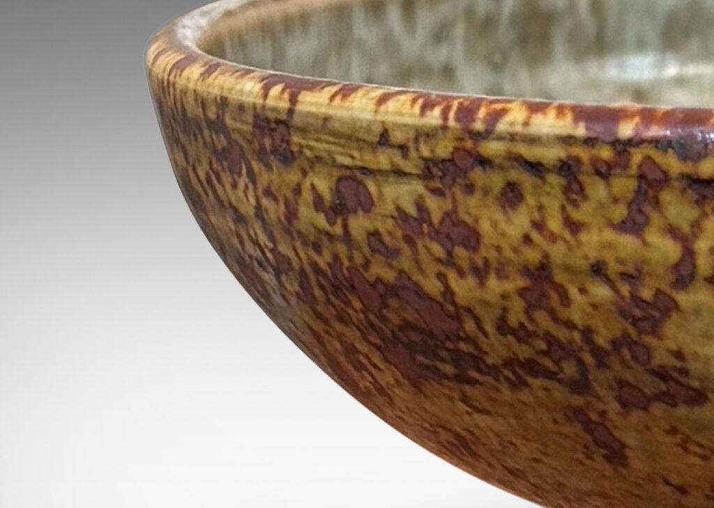 Gallery BAC gently arced form glazed in olive, tan and light blue, stoneware