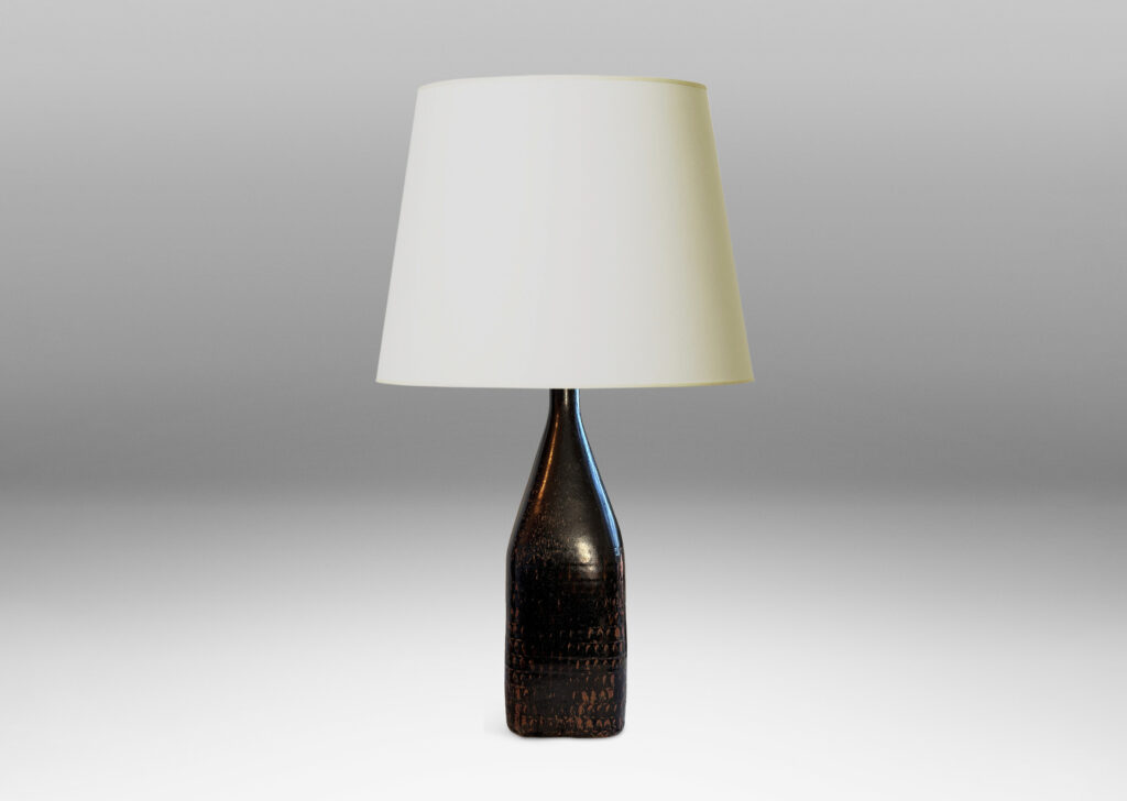 Gallery BAC tall square bottle-like form with rows impressed triangular motifs, glazed in black with hints of red luster