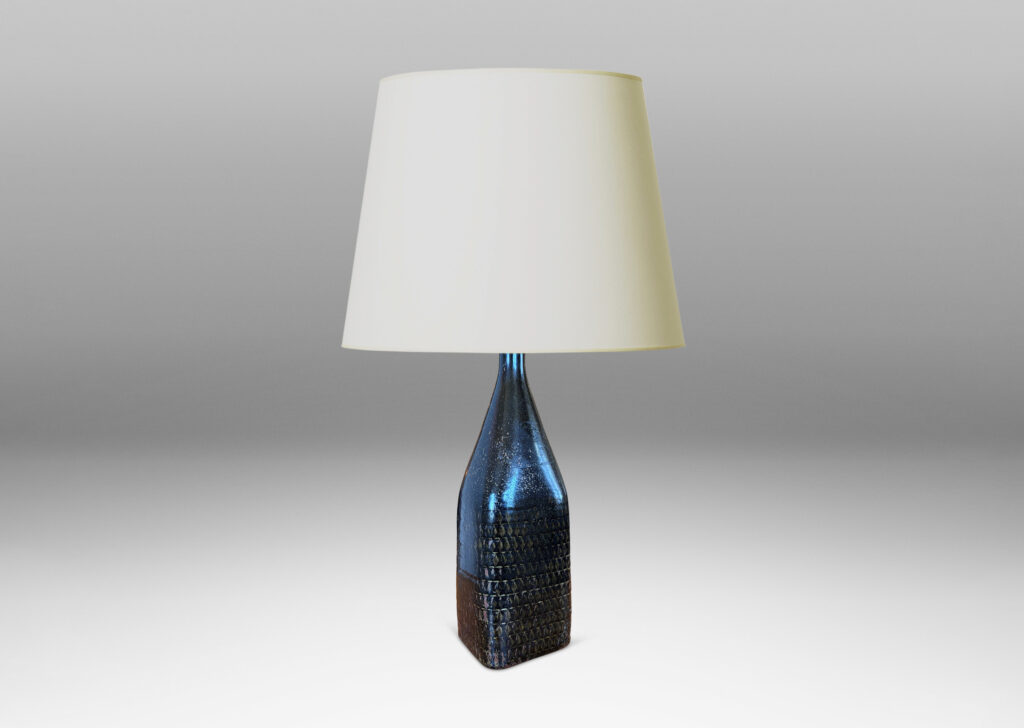Gallery BAC tall square bottle-like form with rows impressed triangular motifs, glazed in black with hints of red luster